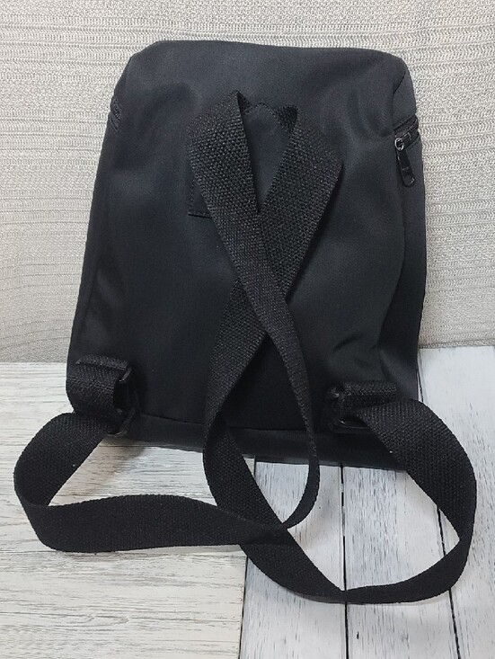 Kate Spade black nylon commuter backpack with a front zip pocket, Woven Straps